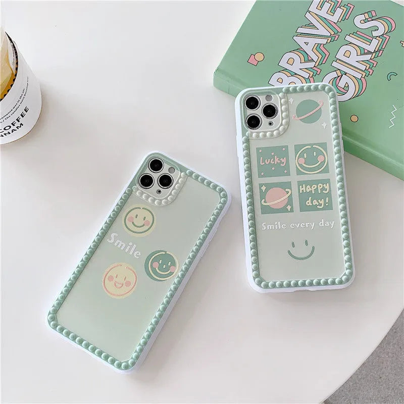 Green geometric pattern TPU iPhone case with polka dot frame and smiley faces, shown from the back.