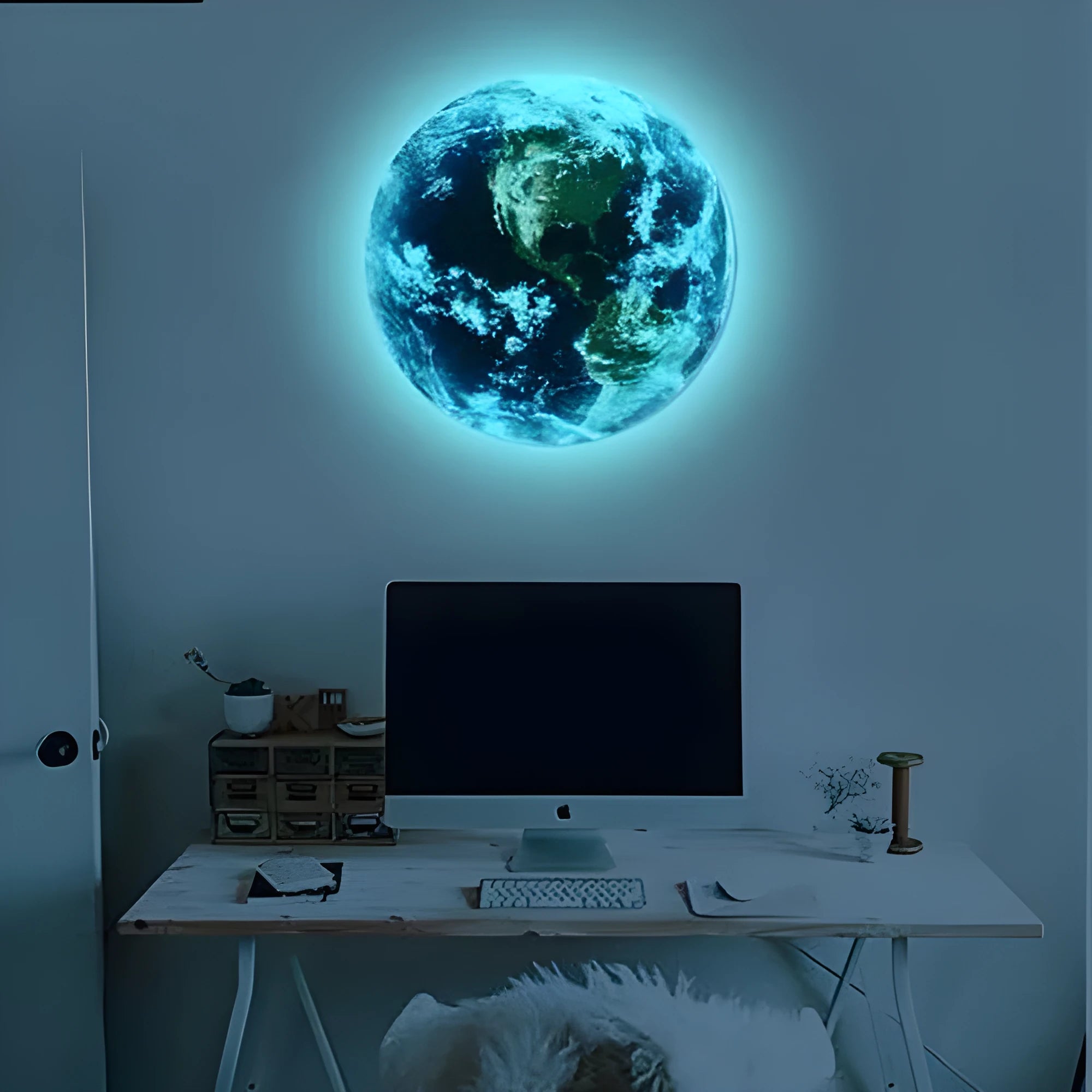 Glow in the dark blue and green Earth planet wall sticker on a bedroom wall.