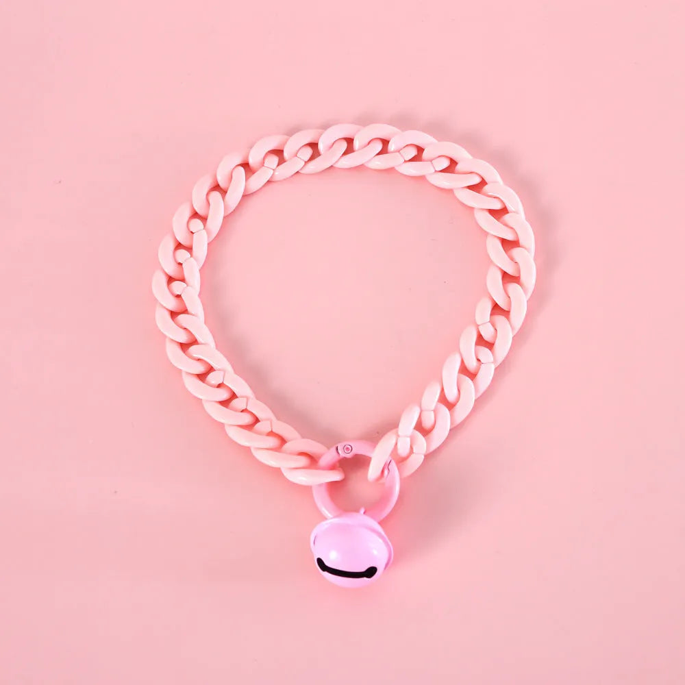 Adjustable plastic pet collar in macaron candy colours on a white background.