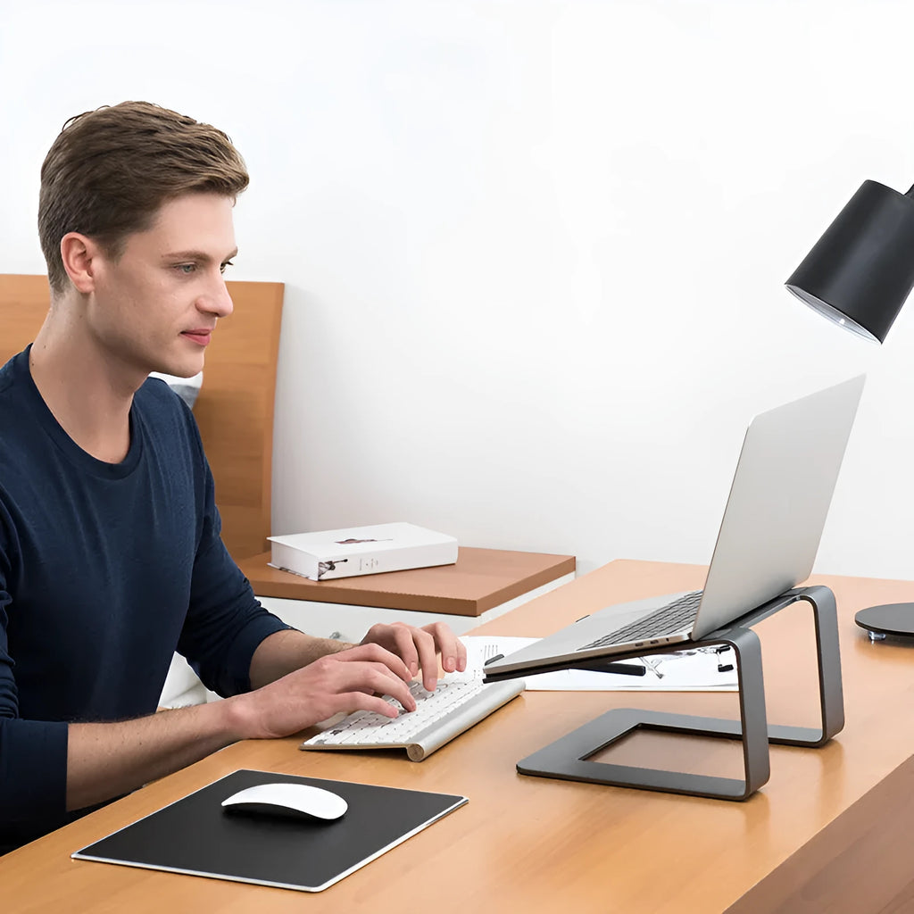 Aluminium alloy laptop stand in black colour on desktop