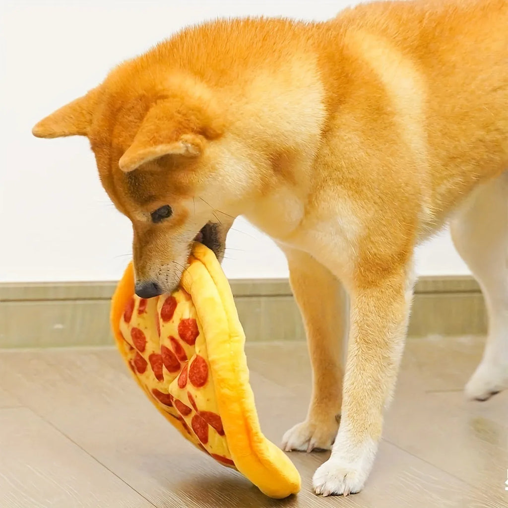 Yellow teddy pizza slice dog chew toy with textured surface and squeaker, 17 cm long.