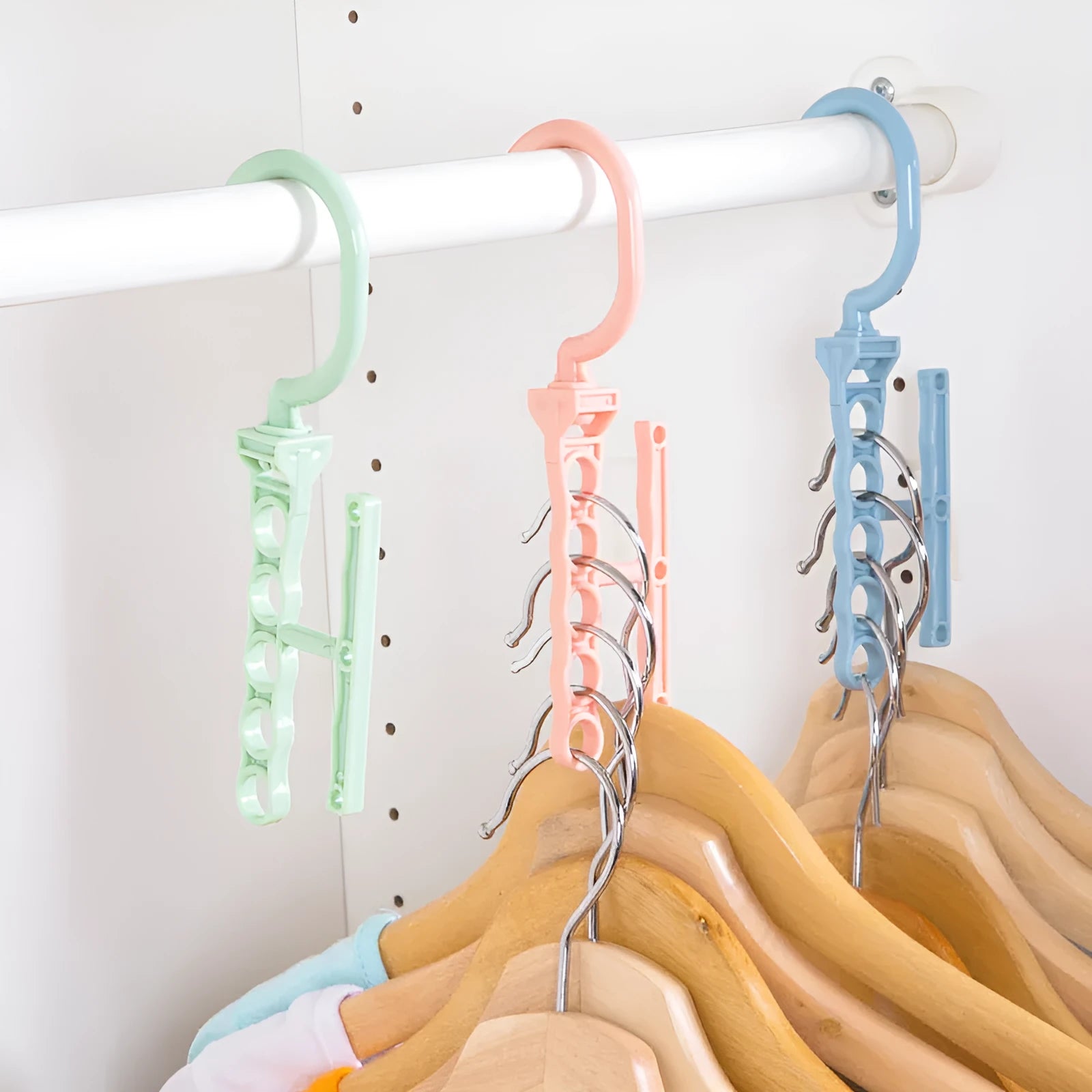 Blue revolving wardrobe hanger with five holes and a handle, made from PP plastic.