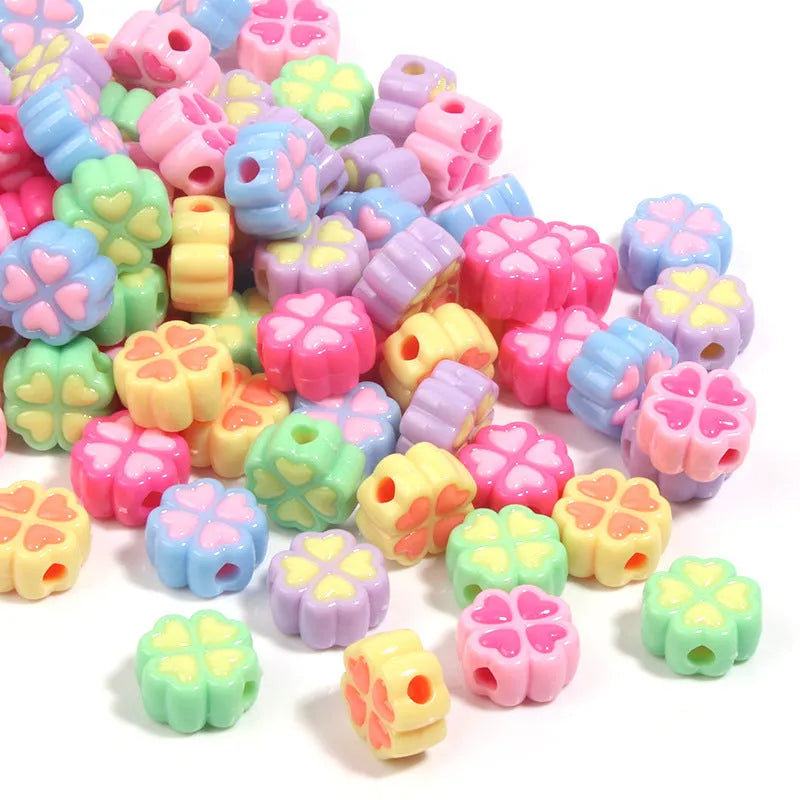 15mm acrylic four-leaf clover beads with frosted finish in various colours including rose red, pink, yellow, green, blue, purple