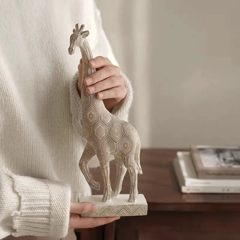 Wood colour synthetic resin giraffe ornament in European style on a shelf.