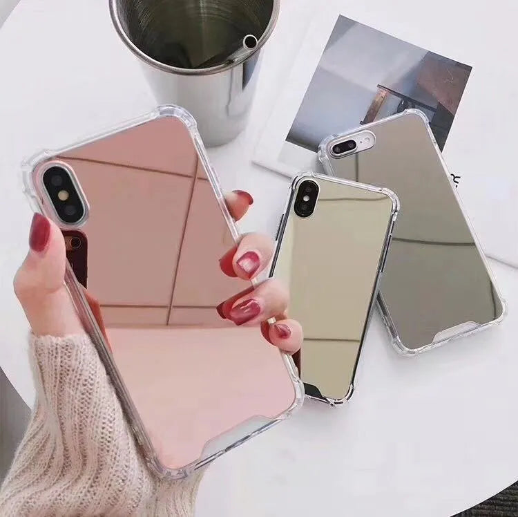Soft TPU Mirror Phone Case for iPhone in multiple colours on a table.