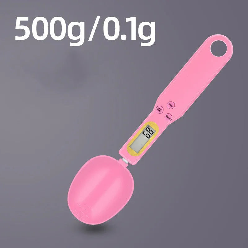 Black electronic digital measuring spoon scale on a kitchen worktop showing weight display.