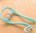 Blue plastic hand roller neck massager with adjustable stand and removable massage heads on a white background