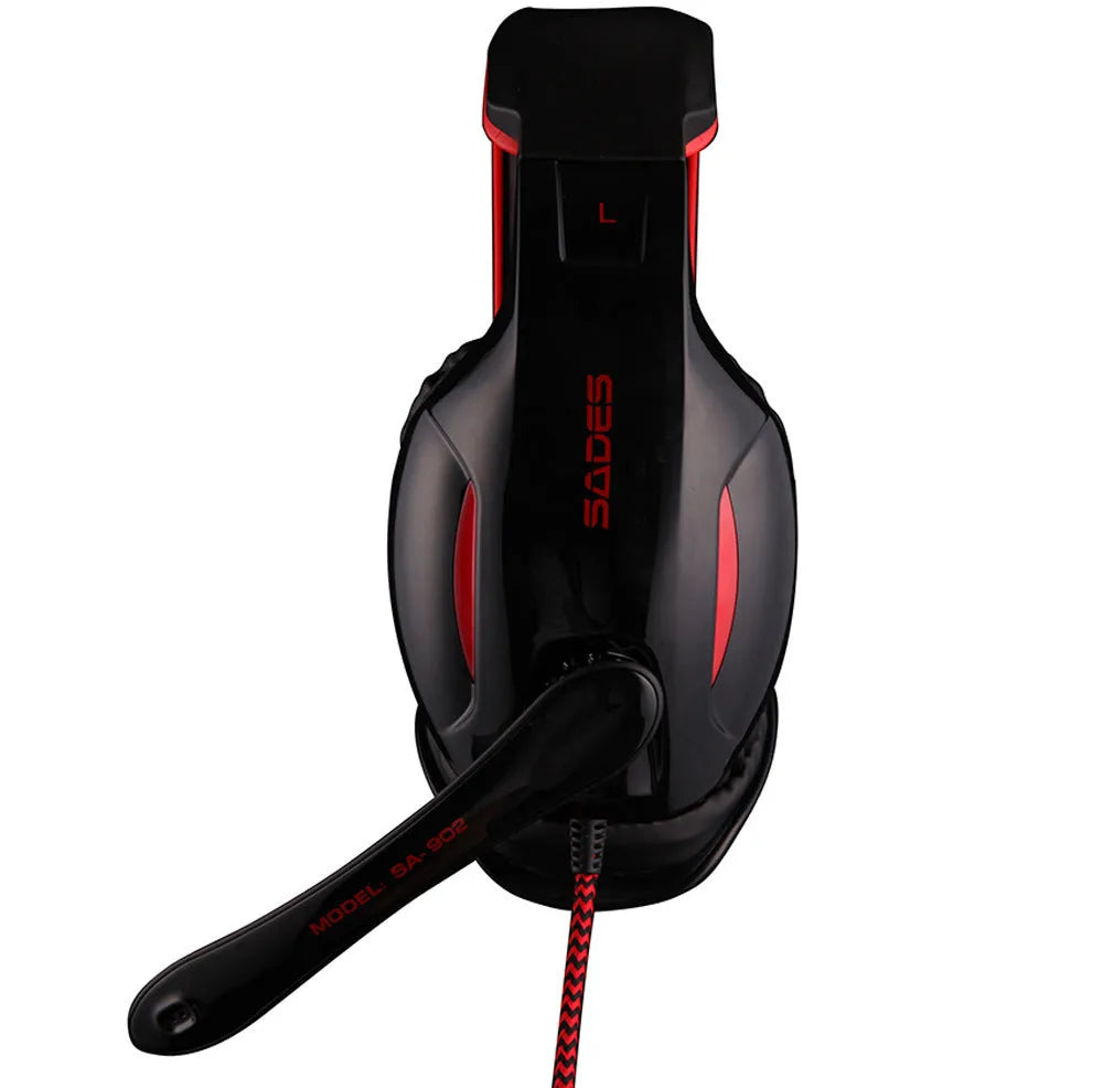 Black SADES SA902 wired USB gaming headset with over-ear cups and adjustable headband on a desk