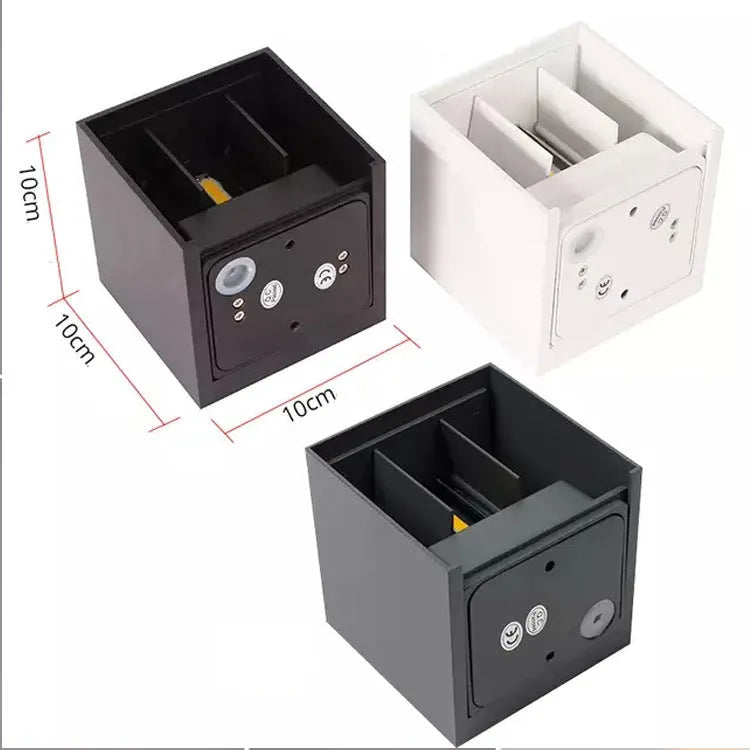 Compact cubic corridor wall lamp in black finish with adjustable colour temperature settings
