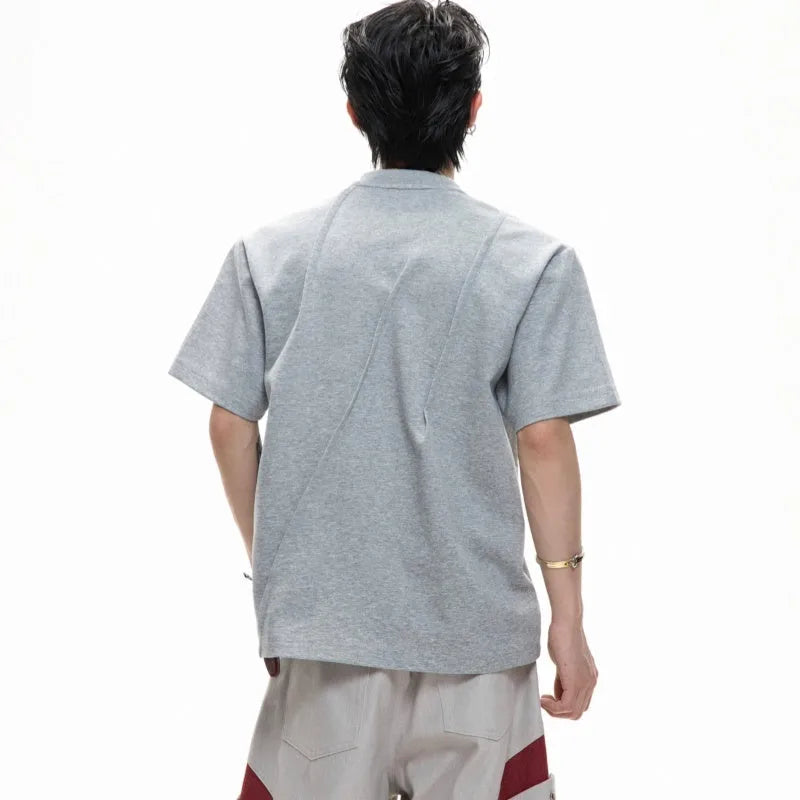 Men's loose-fit cotton T-shirt with three-dimensional pleats and asymmetric stitching in solid colour