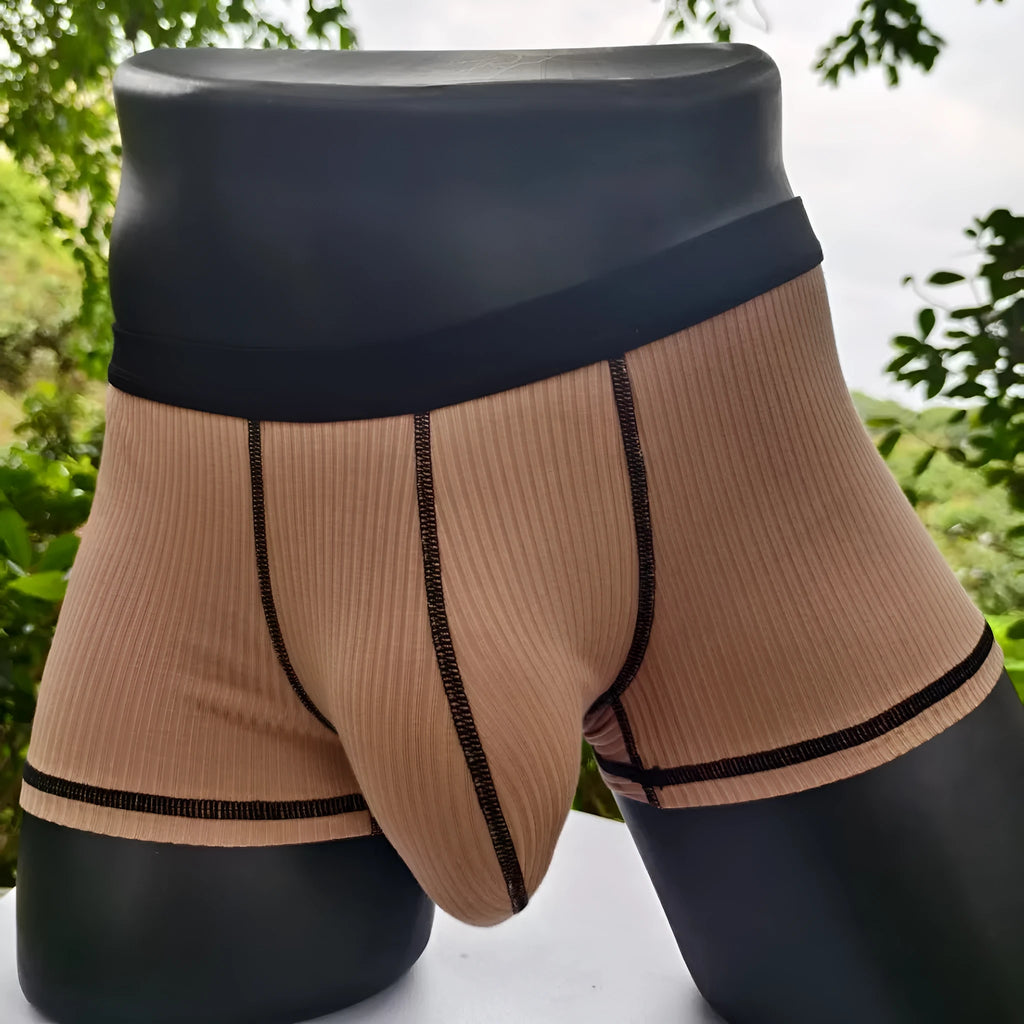 Men's solid-colour fibre boxer shorts on a white background showing hip-lifting design.