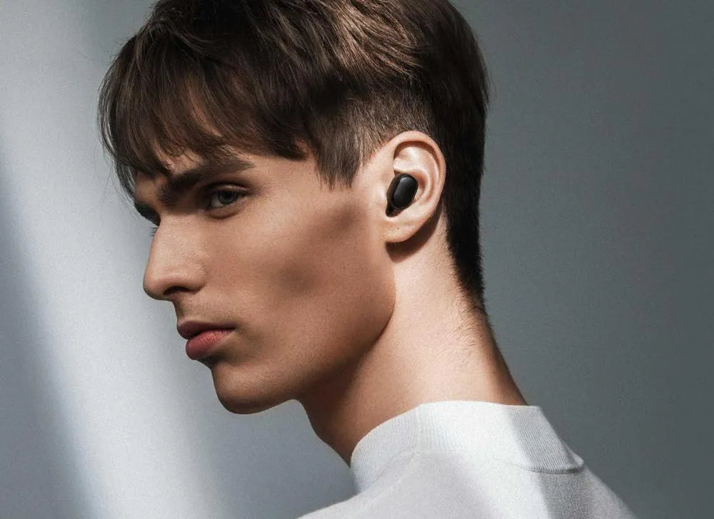 Redmi AirDots 2 black true wireless earbuds with charging case on a white background.