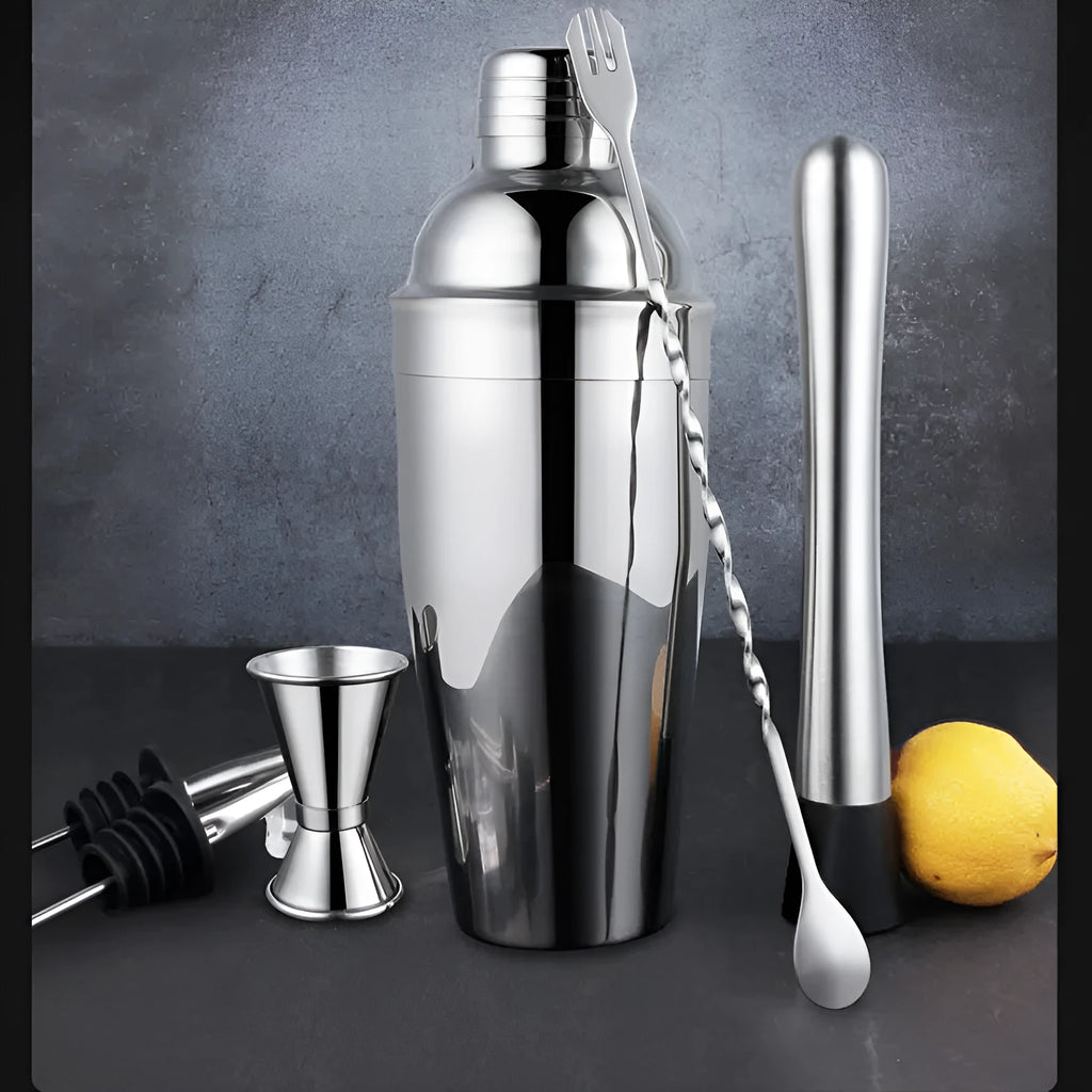 23-piece stainless steel cocktail set with acrylic European-style mixers arranged on bar surface