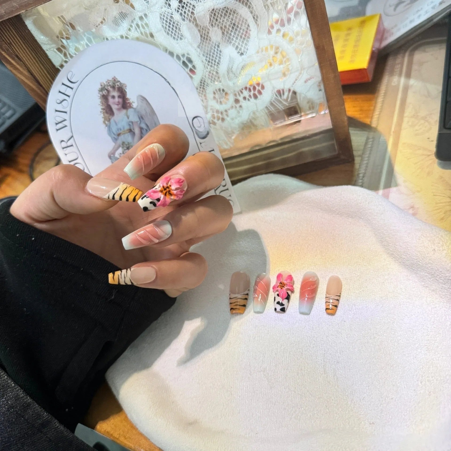 Hand carved zebra pattern nail art with embossed flower and leopard print designs in four size options