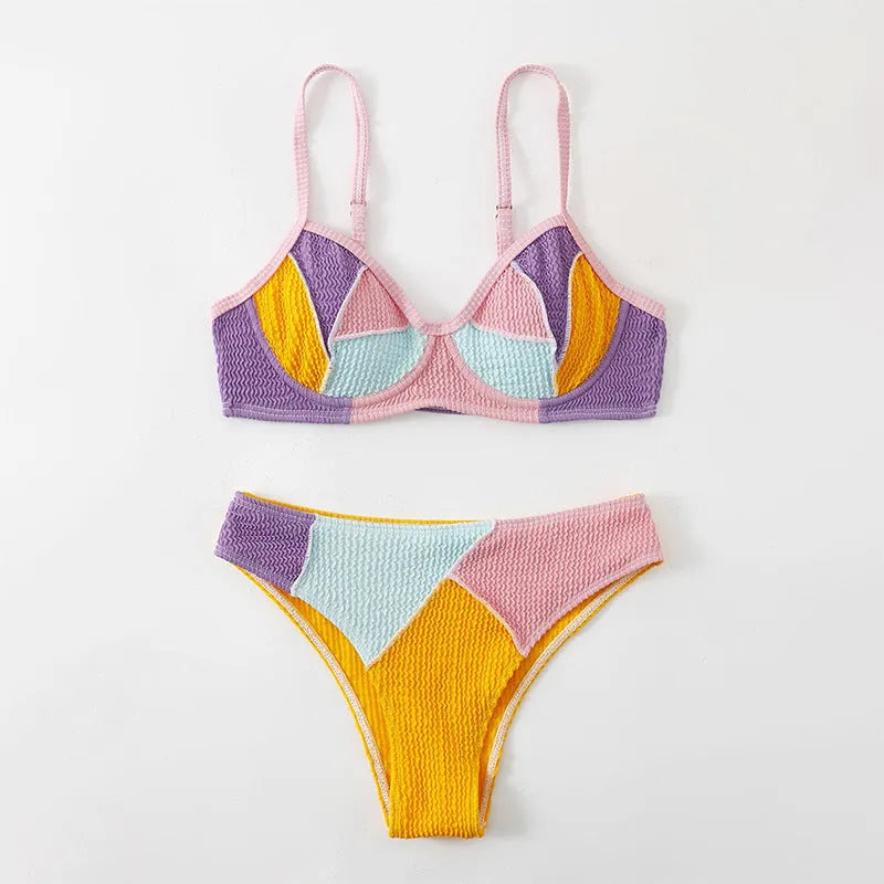 Women's colour block bikini set with halter neck top featuring steel underwire and matching shorts.