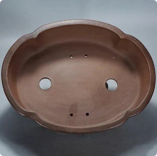 A classical style purple clay bonsai flower pot with simple design.
