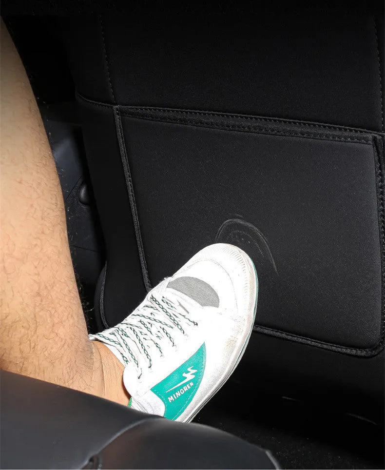 Black leather rear anti kick pad for car seats, shown with storage pocket.