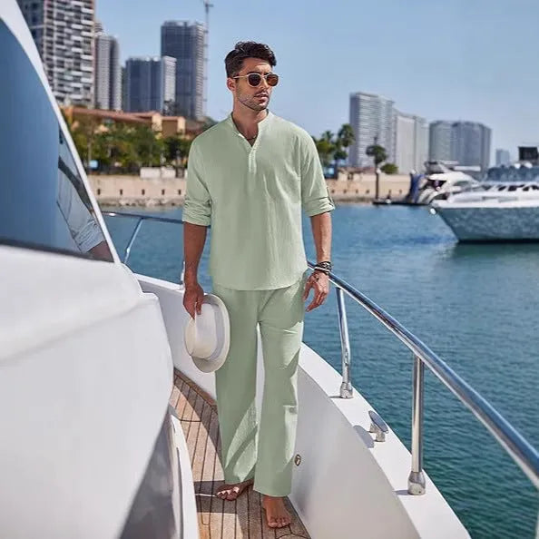 Man wearing a solid colour cotton long sleeve top and matching trousers from a casual suit.