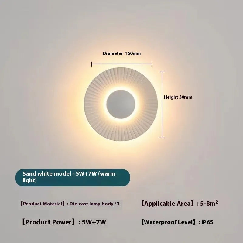 Round aluminium wall lamp with LED light in various colour options including white and gold variants