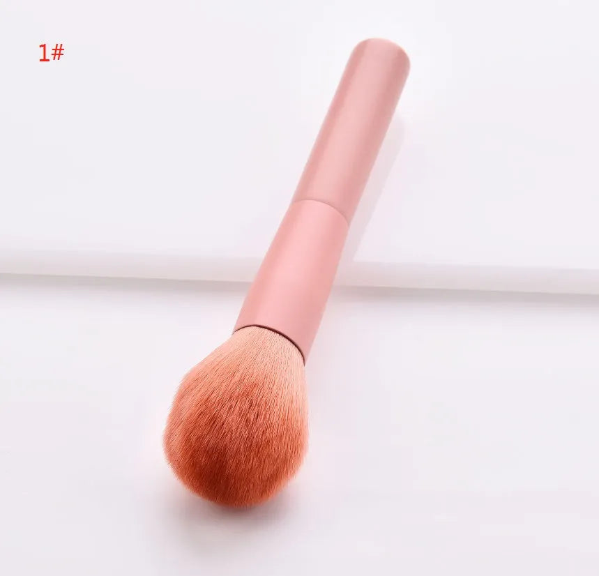 10 professional makeup brushes with wooden handles, including powder, foundation, and double-ended detail brushes.
