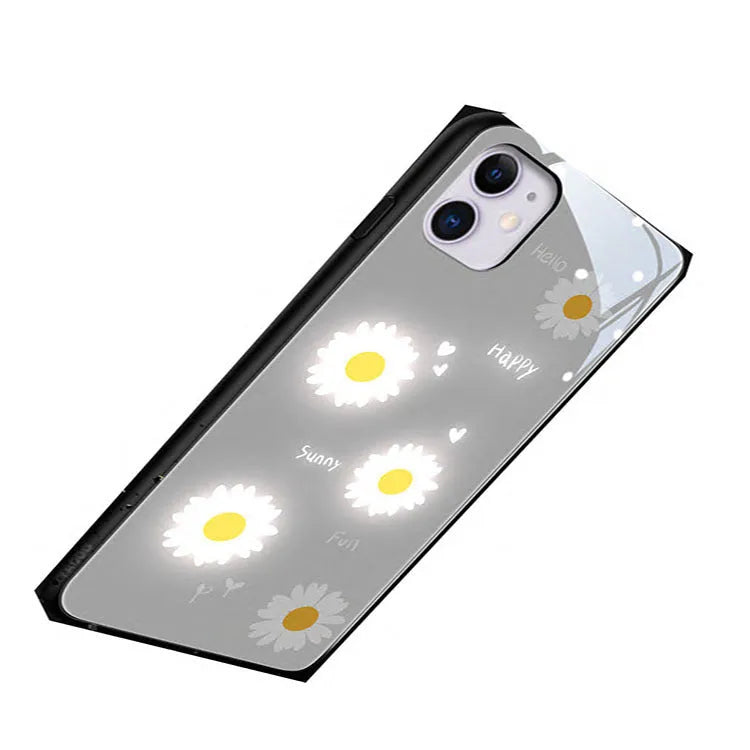 Luminous iPhone case with voice-activated colour light showing white daisy pattern on TPU protective shell