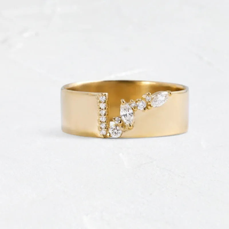 Gold-coloured electroplated copper band ring for women shown on a finger.