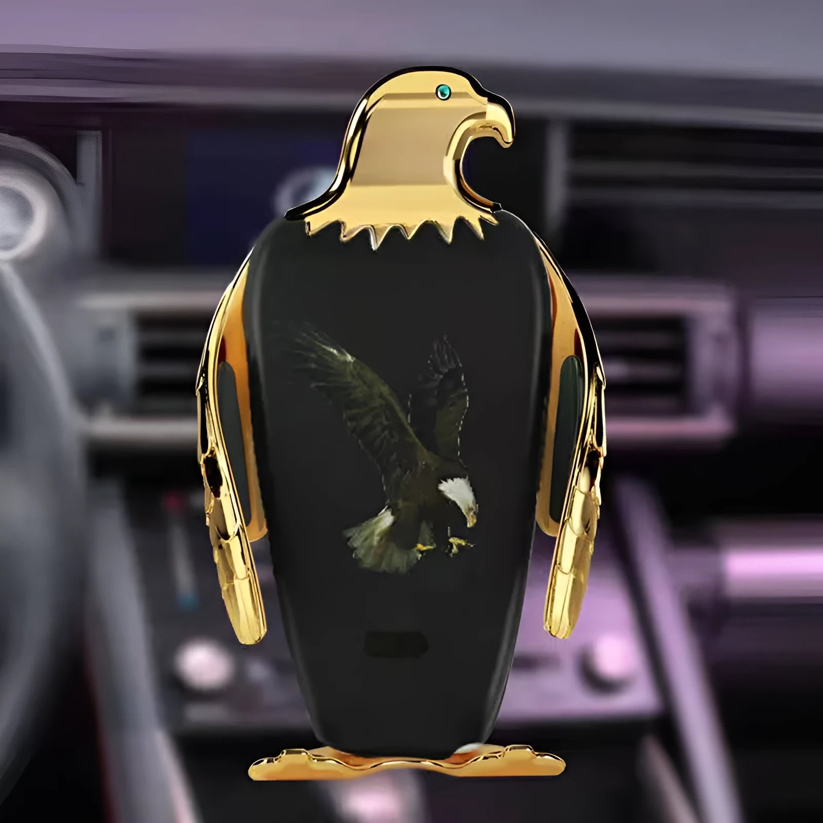 Car phone holder with wireless charging pad and Eagle design on a car dashboard.