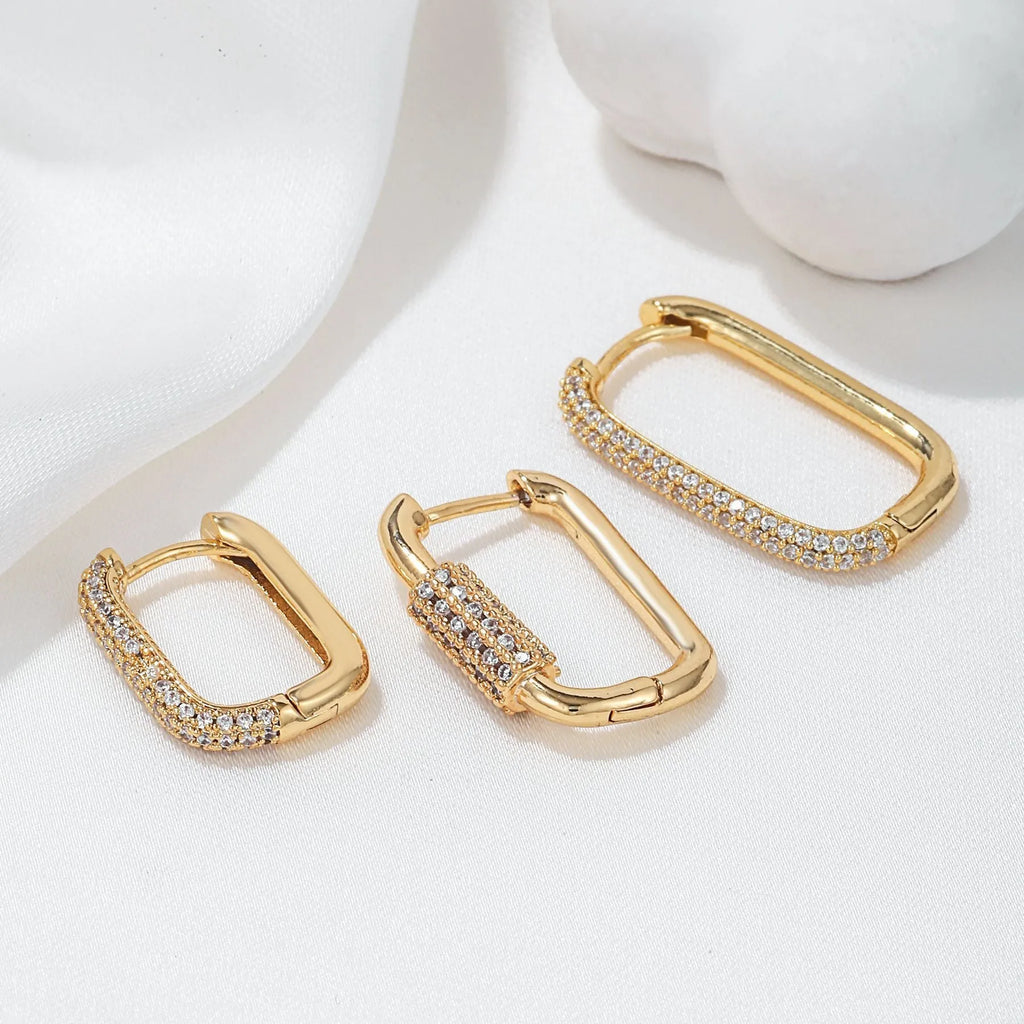 Three geometric ear clips with micro inlaid zircon in gold and white metal colours
