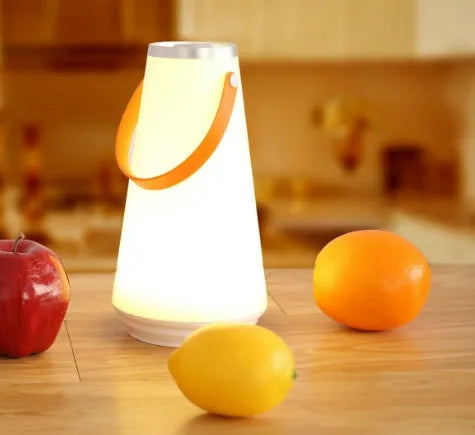White rechargeable LED table lamp with adjustable warm light settings and USB charging cable