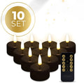 Four black LED tealight candles showing realistic flickering flame effect