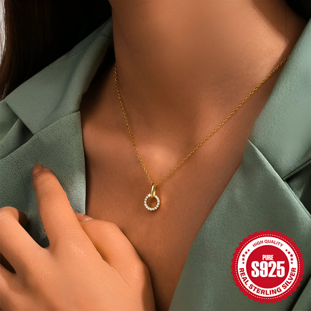 Gold tone S925 sterling silver clavicle chain with geometric interlocking zircon pendant.