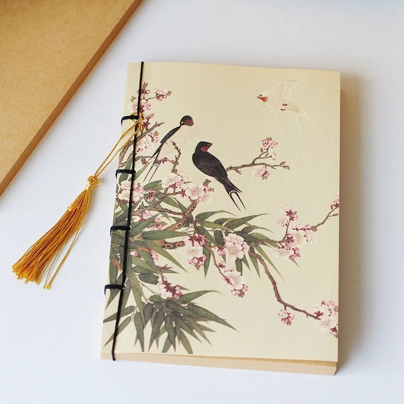 A5 antique wire-bound notebook with retro painting cover, thread binding, and black tassels.