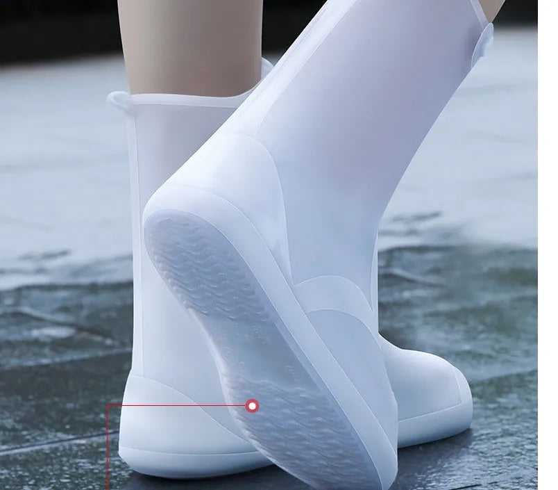 White PVC high-top reusable shoe covers for women, shown on a shoe for rainy day outdoor protection.