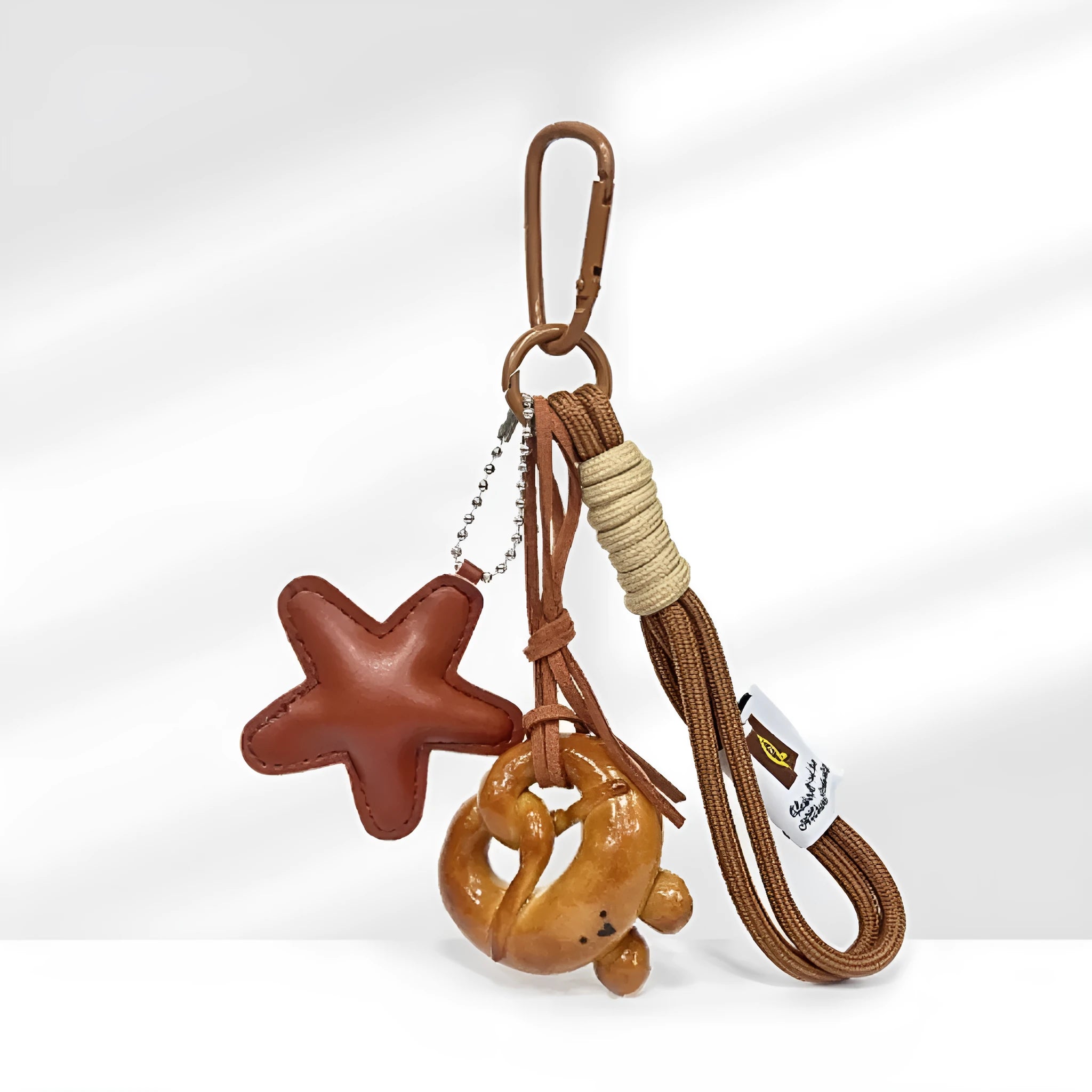 Handmade soda bread style handbag pendant with cartoon pastry designs and brown strap