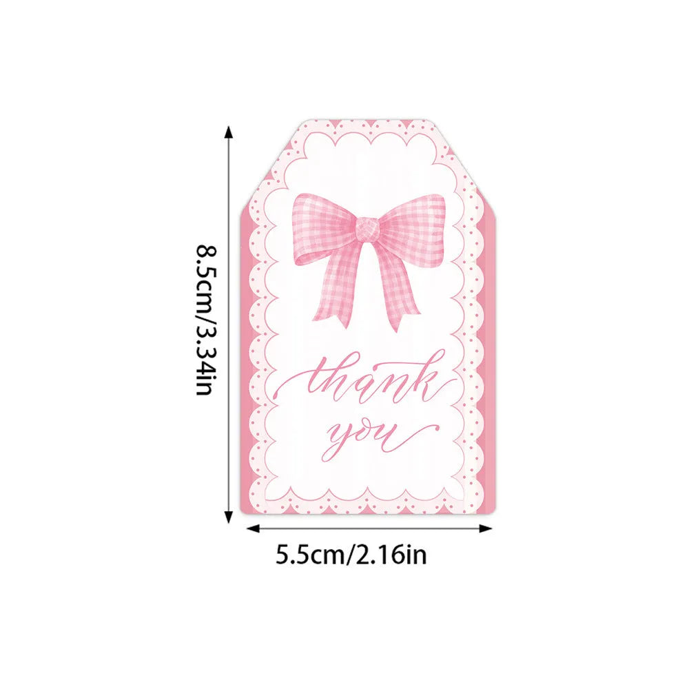Set of 60 paper birthday gift tags with bowknot designs and natural hemp rope.