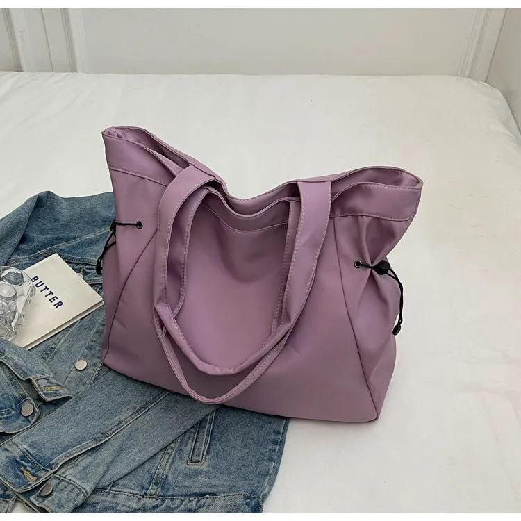 Soft foldable Oxford cloth commuter shoulder tote bag in street trend style.