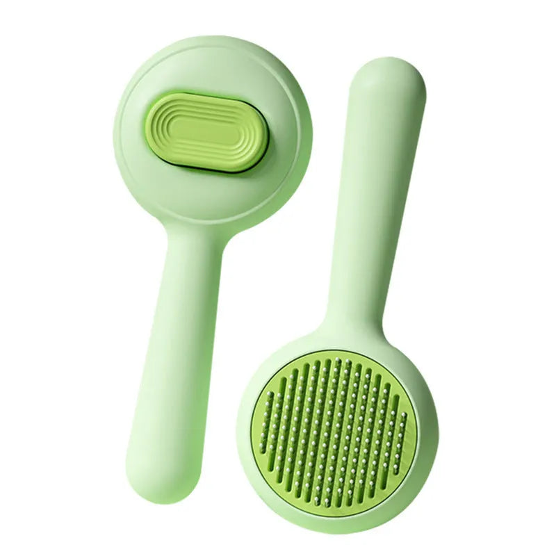 Green pet grooming brush with stainless steel teeth and non-slip handle