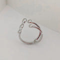Brass adjustable fashion ring with spherical detail in gold or silver finish.