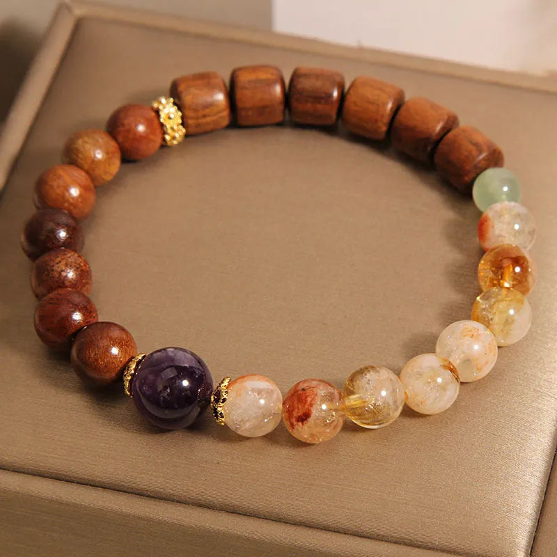 Women's crystal bracelet with yellow tower crystal and ebony amethyst beads featuring pearl and rhinestone accents
