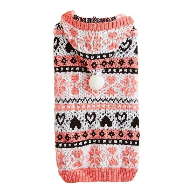 Pink striped camouflage knitted dog sweater with snowflake and heart pattern on a small white dog.