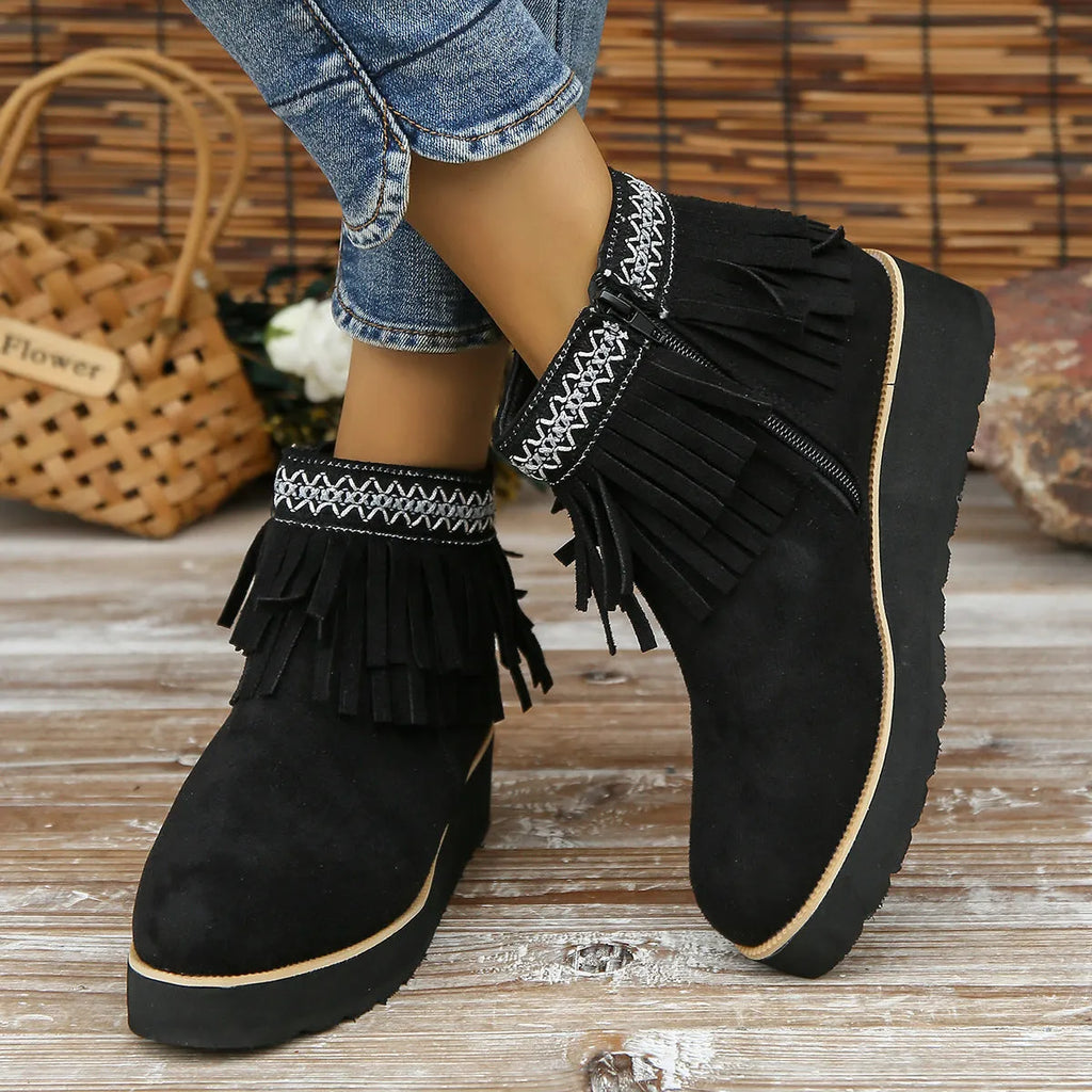 Women's black suede wedge ankle boots with a thick platform sole and side zipper.