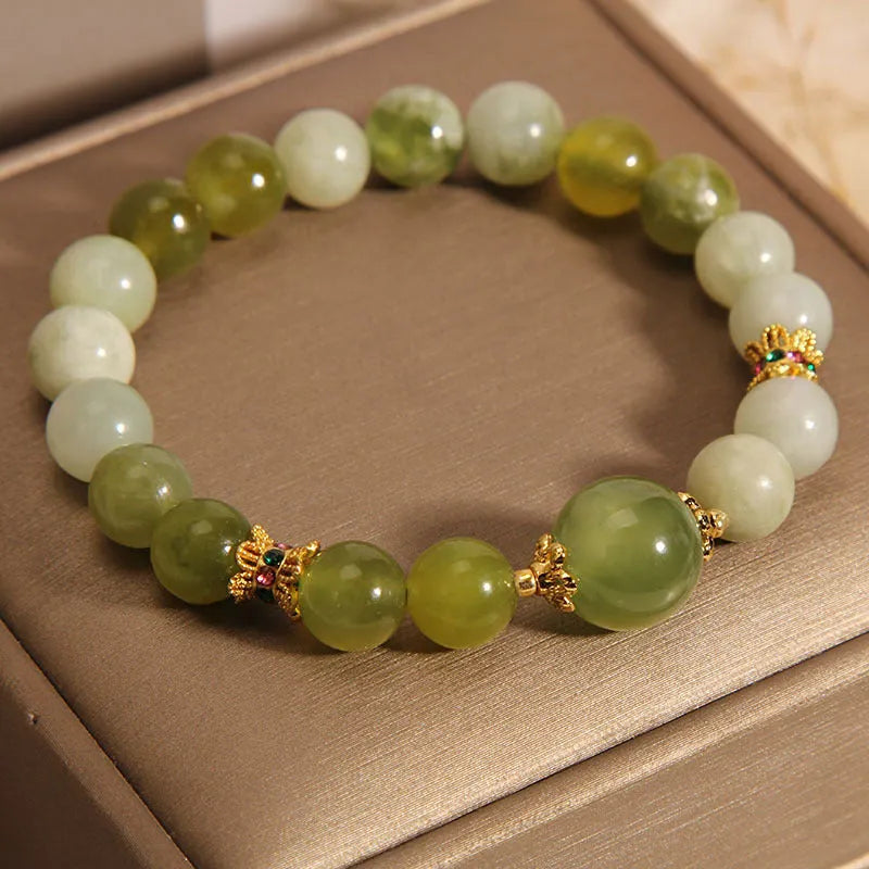 Women's bracelet made of natural green Xiuyan jade in a sweet Mori style.