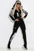 Black women's casual suit with printed hooded jacket and matching trousers.