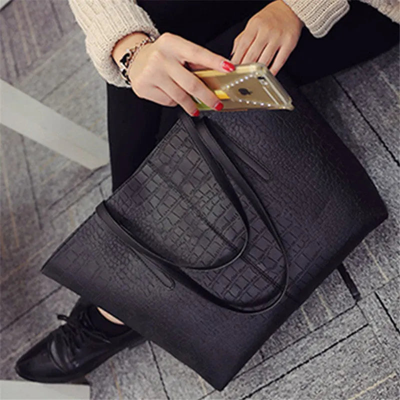 Simple fashion shoulder bag with adjustable strap shown in black and grey colour options