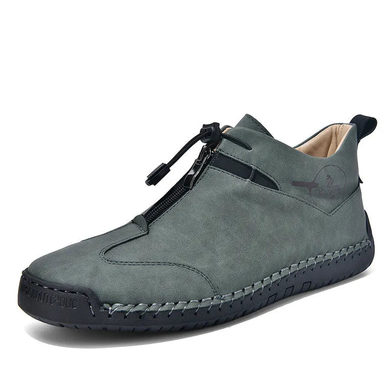 Men's black casual leather shoes with a mid-heel and rounded toe on a neutral background