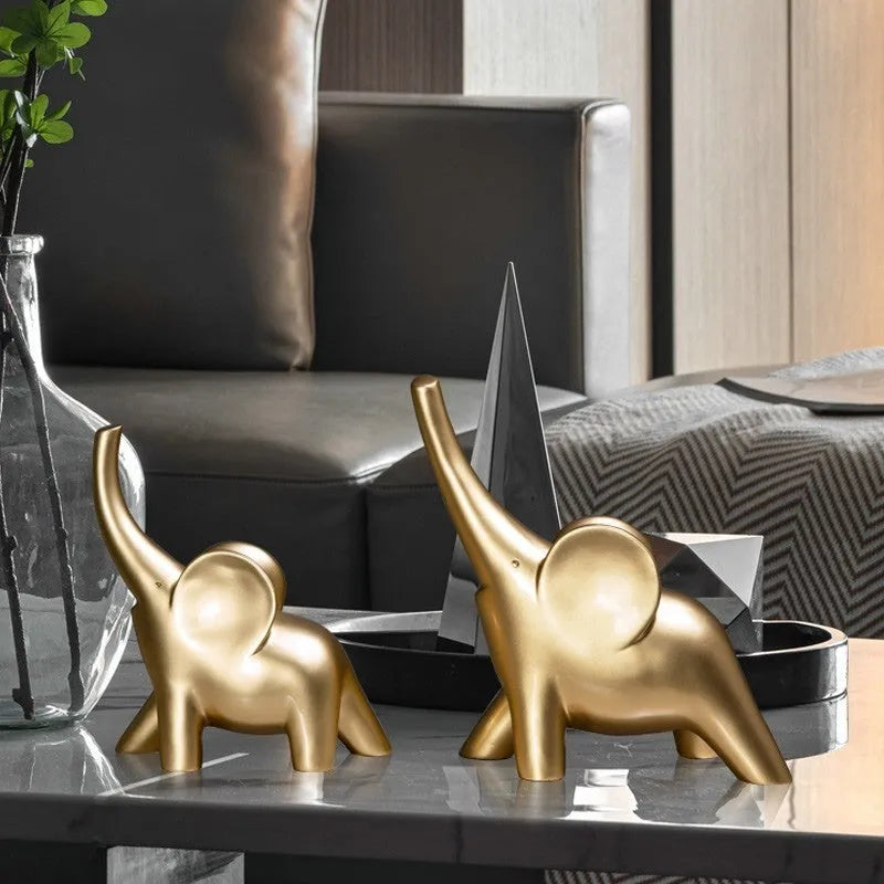 Rose gold and white resin elephant ornaments in large and small sizes displayed singly and as pairs
