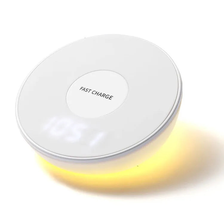 White wireless smartphone charger with digital clock display and three control buttons on the front.