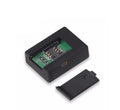 Black N9 mini car GPS tracker X009 with removable back cover showing SIM card slot