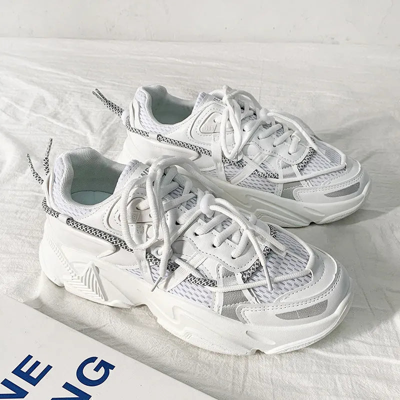 Men's white Korean-style platform dad shoes with a lace-up front on a grey background.