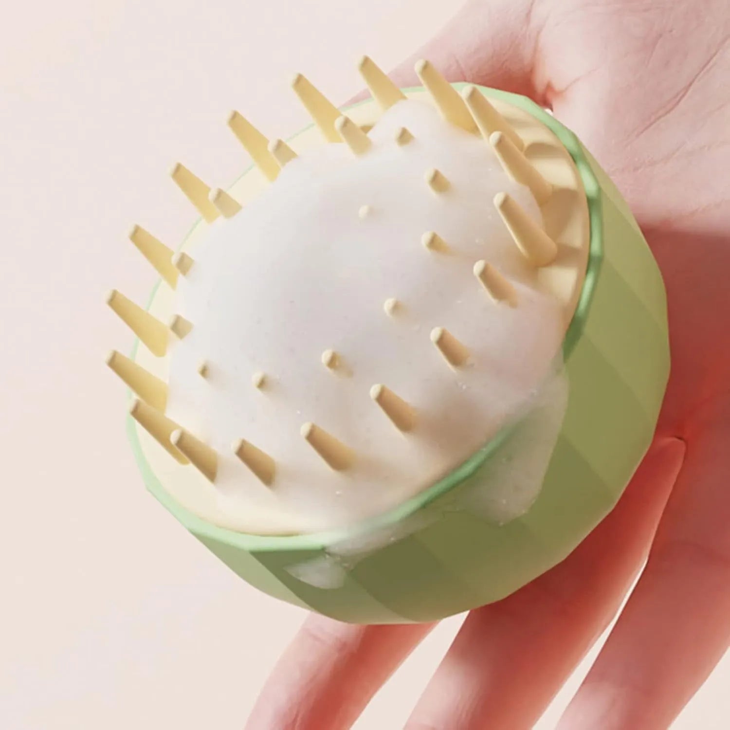 Green silicone dog bath brush with drainage holes and massage bristles for pet shampoo application